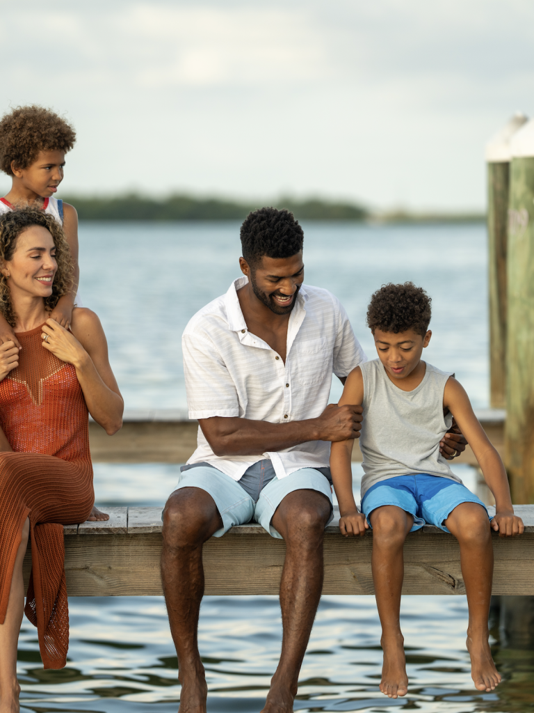 Family Sitting on dock