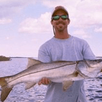 captain rich holding a fish