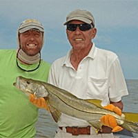 captain scott holding a fish