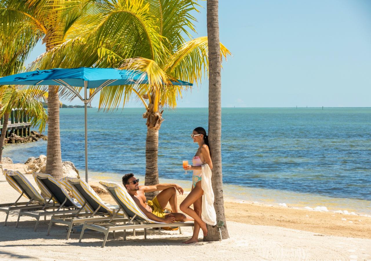 A couple sitting at the beach.