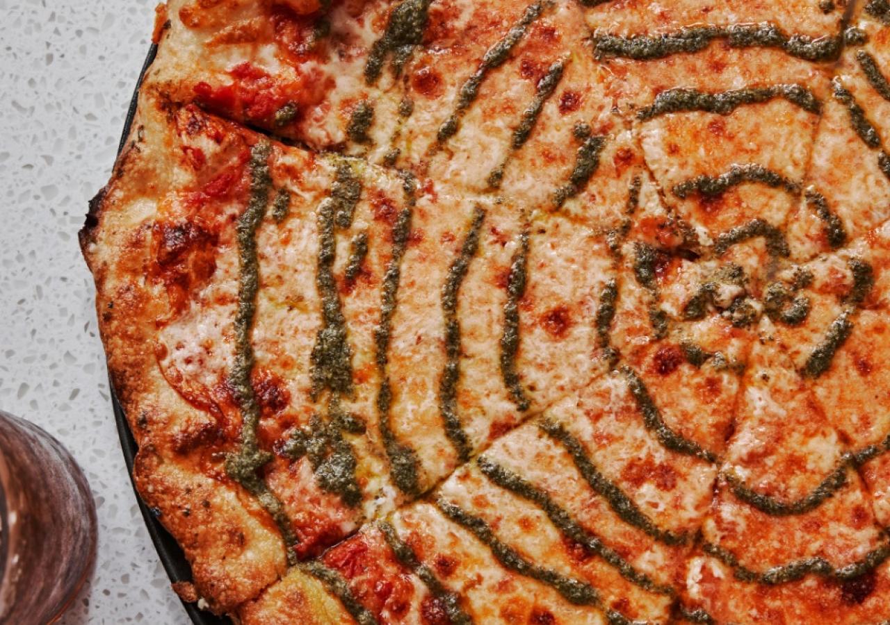 A close up of a cheese pizza.