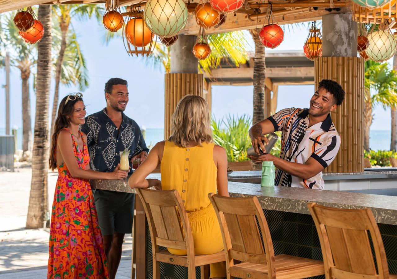 People talking to the bartender at Tiki Bar