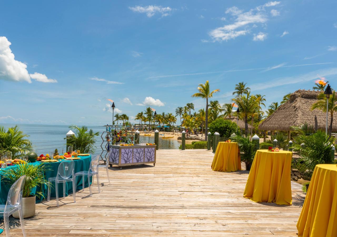 wooden pier with colorful event tables