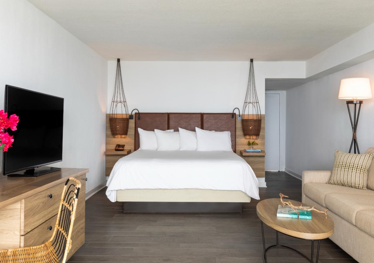 A view of the king size bed in an oceanfront view at Amara Cay.