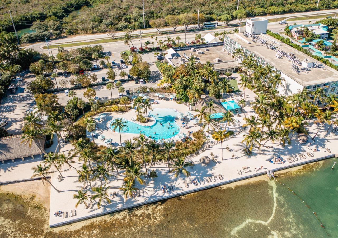 An aerial view of Amara Cay Resort showing the oceanside pool and beach in the Florida Keys.