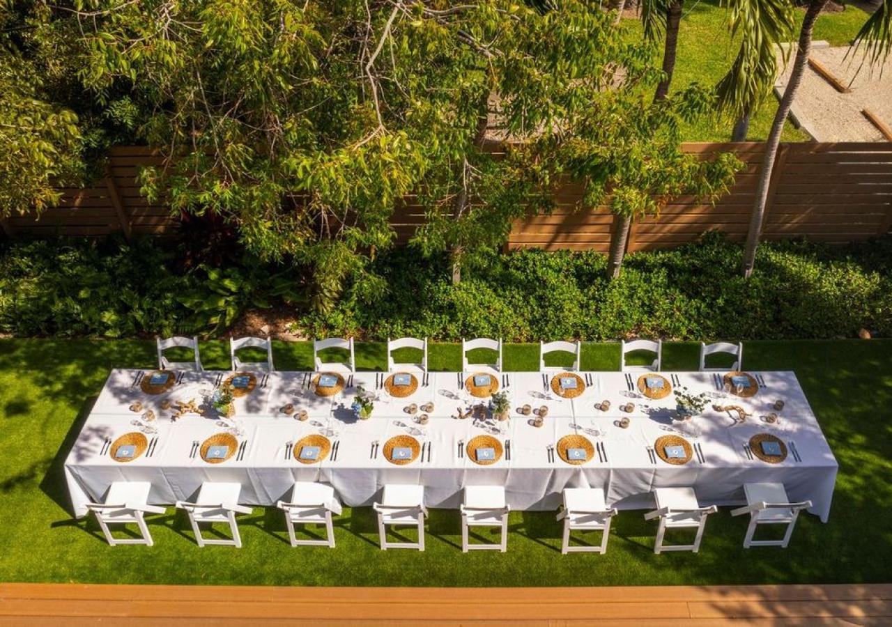 image of long tablescape in green backyard