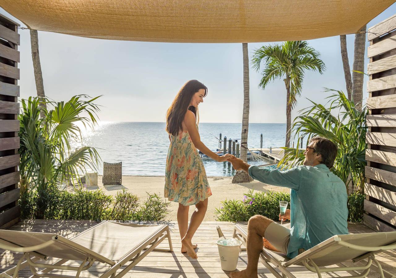 a couple holding hands on the lanai