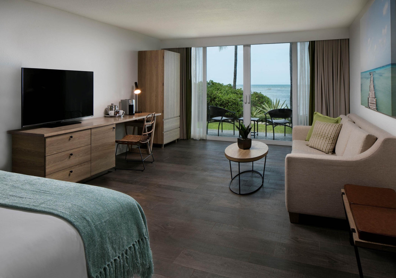 bedroom with sitting area and television