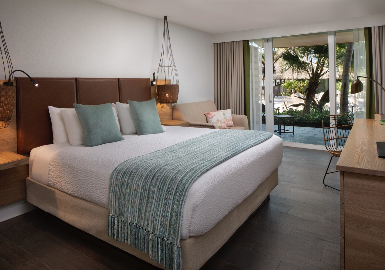 bedroom with lanai view of courtyard