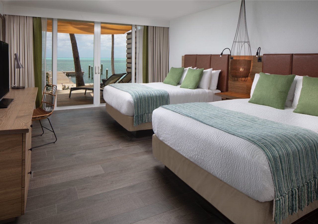 bedroom with two queen beds and a view of the ocean