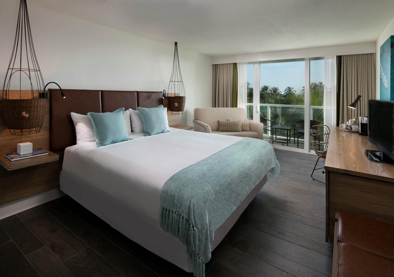bedroom with chair and balcony