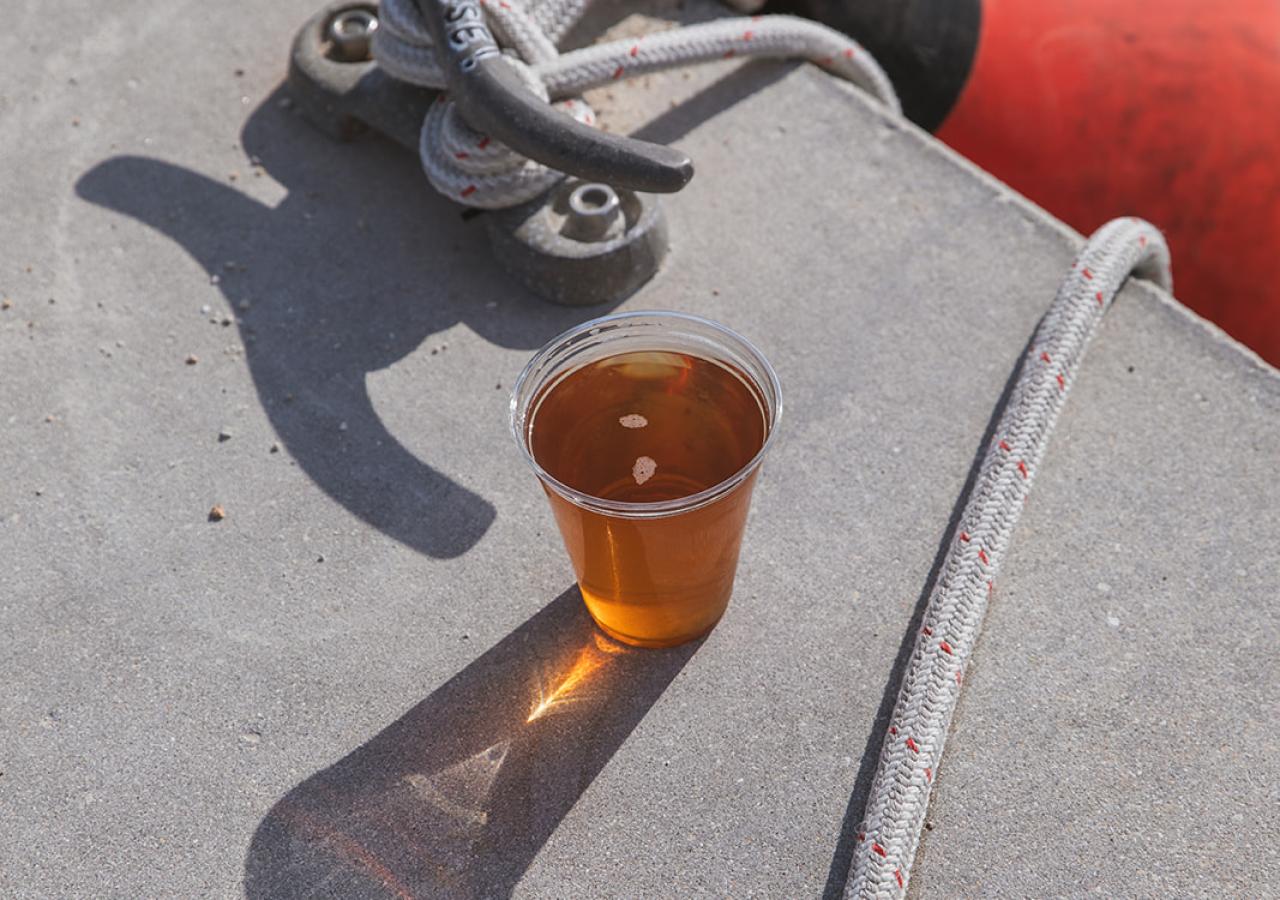 A drink sits by the edge of a dock and buoy at La Siesta in the Florida Keys.