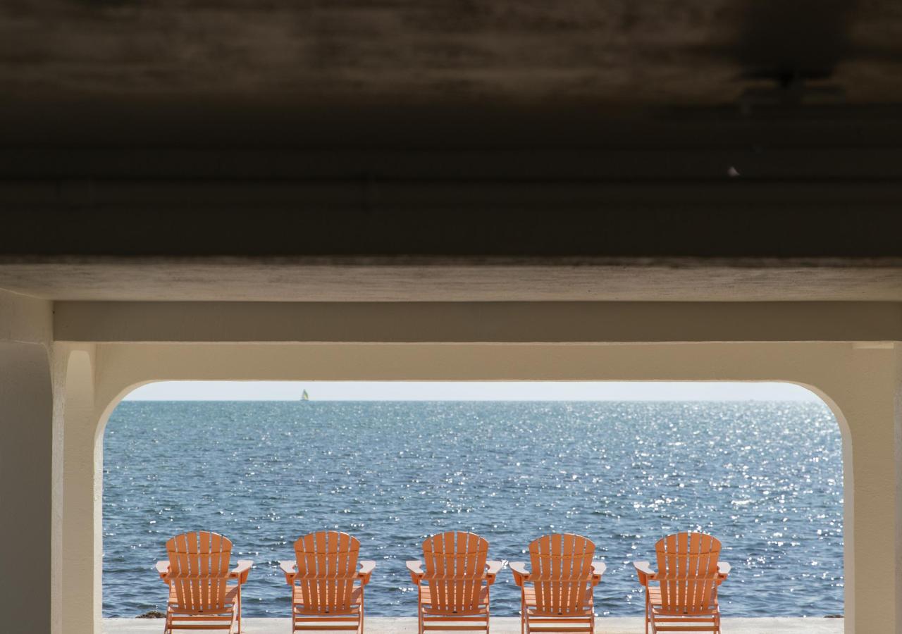 5 lounge chairs facing the ocean in the Florida Keys at La Siesta Resort & Villas.
