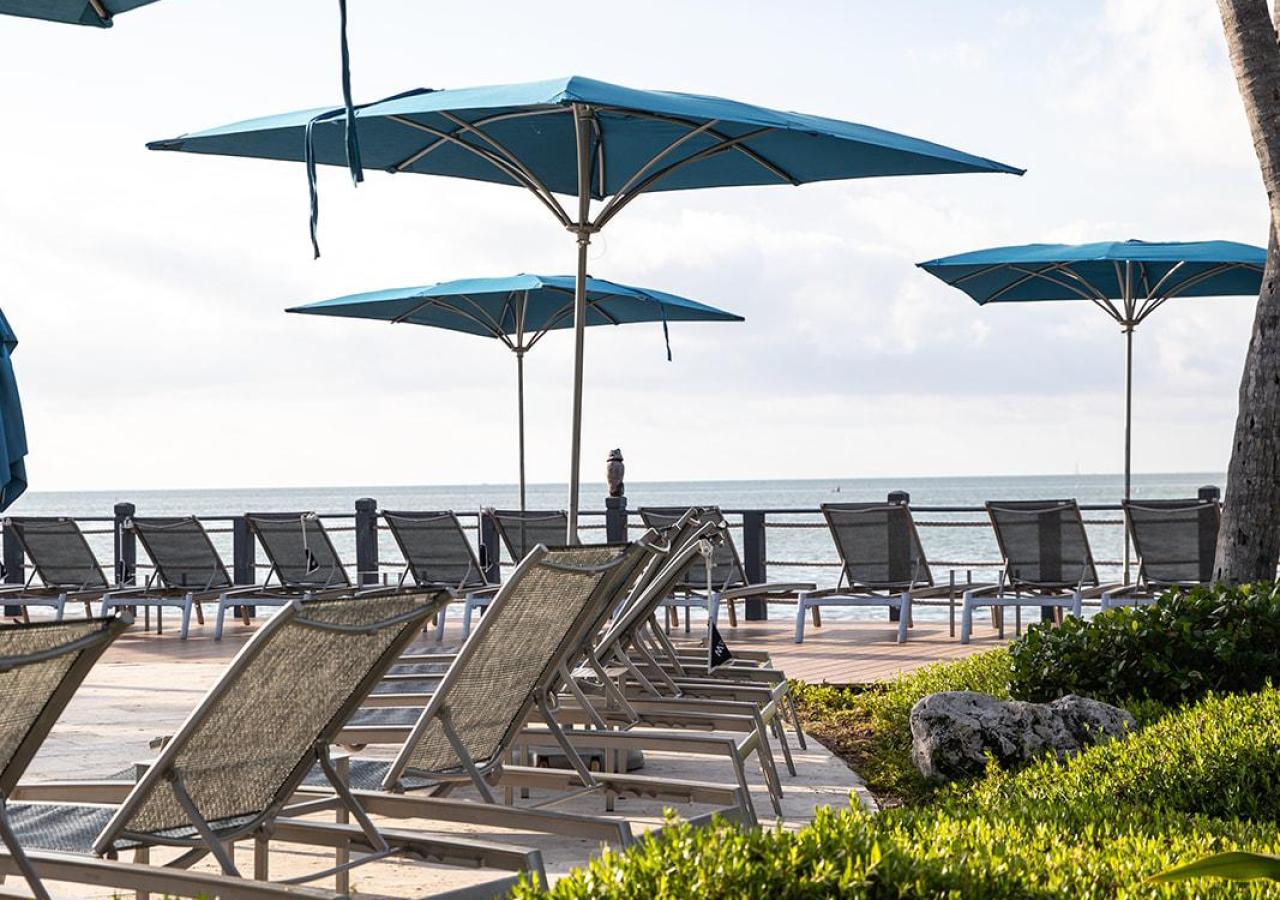 Chaise lounge chairs at Kokomo pool at Three Waters Resort & Marina in Islamorada, Florida.