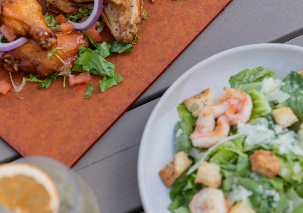 A salad and wings from La Siesta Resort & Villas.