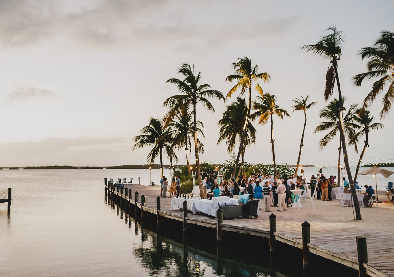 guests having an event on a dock by the ocean