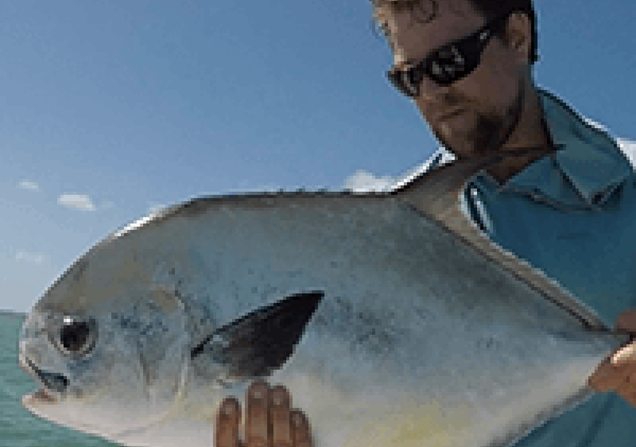 captain josh holding a fish
