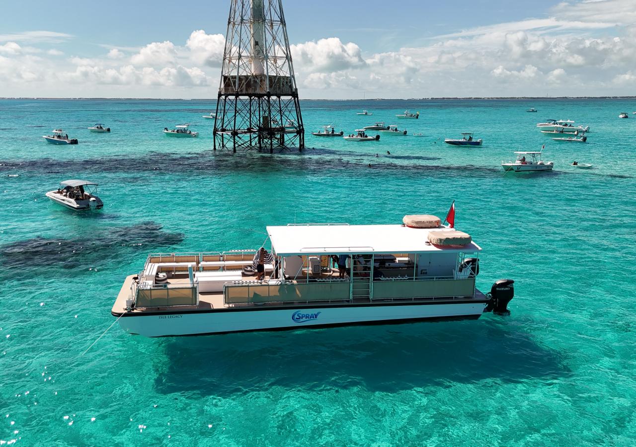 The 55' Isle Legacy boat by Spray Watersports in Islamorada, Florida at the Alligator Reef Lighthouse.