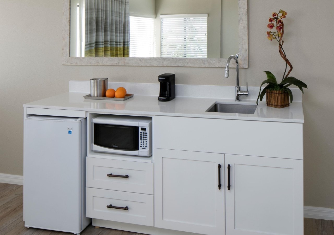 small kitchenette with microwave and mini fridge