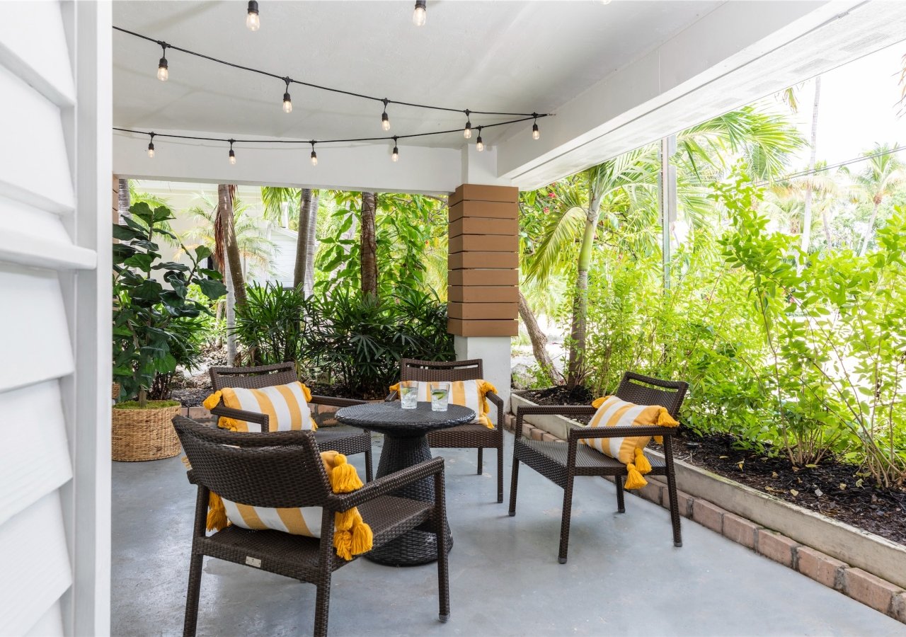 outdoor patio set with small table and three chairs