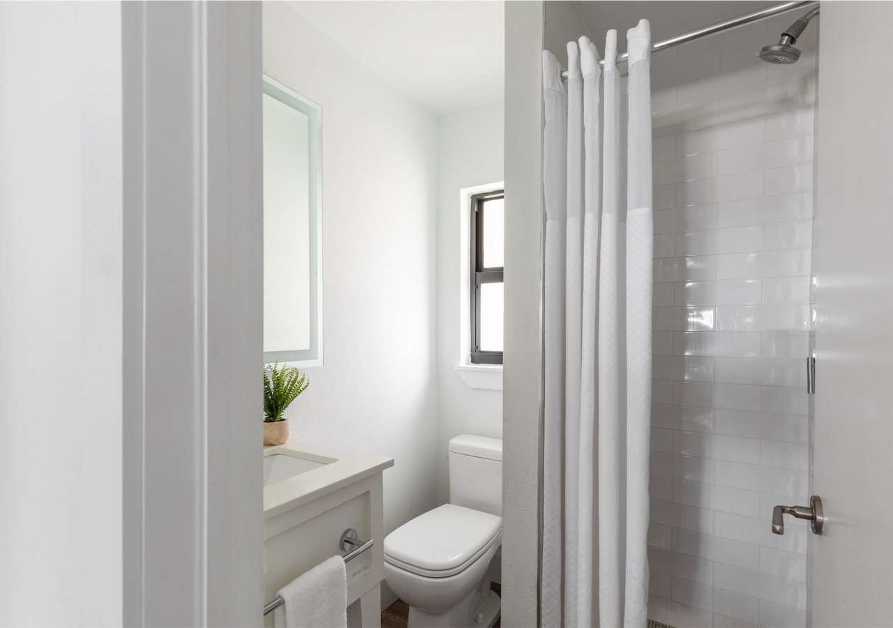 bathroom with small walk-in shower
