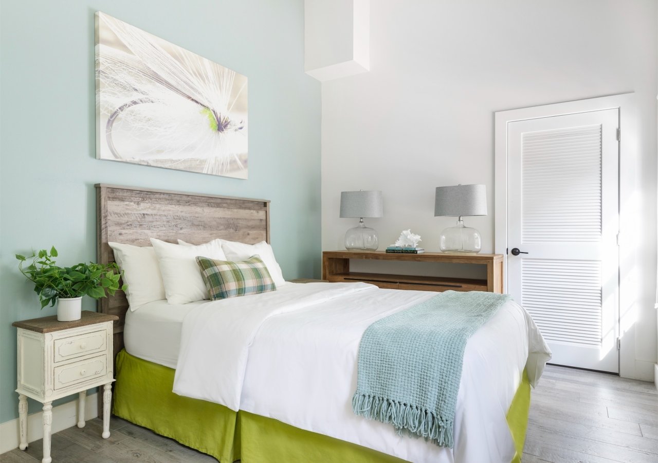 bedroom with sea blue wall and lime green highlights