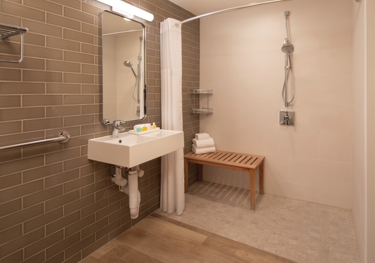 Bathroom with walk-in shower and bench
