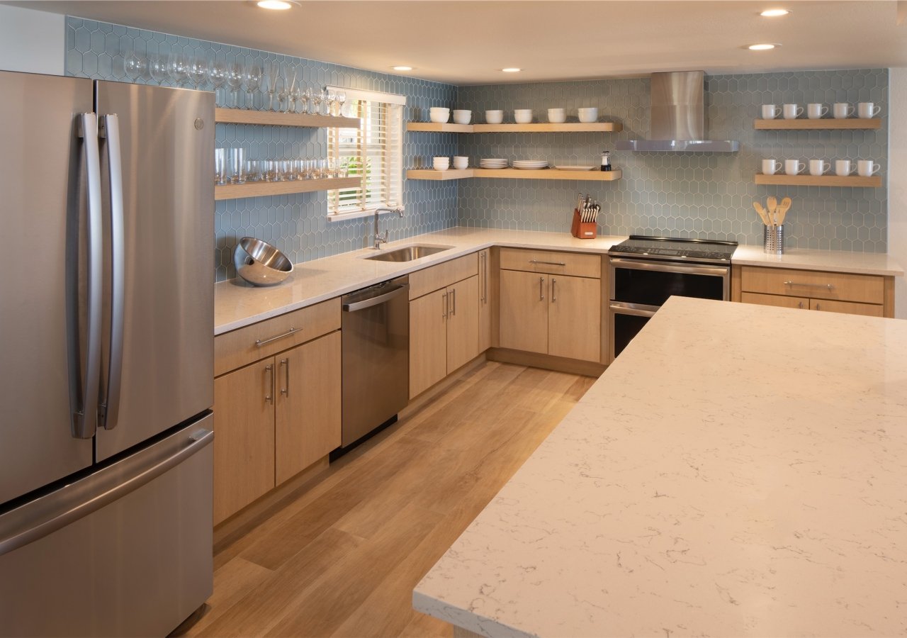 large kitchen with exposed shelving and large island