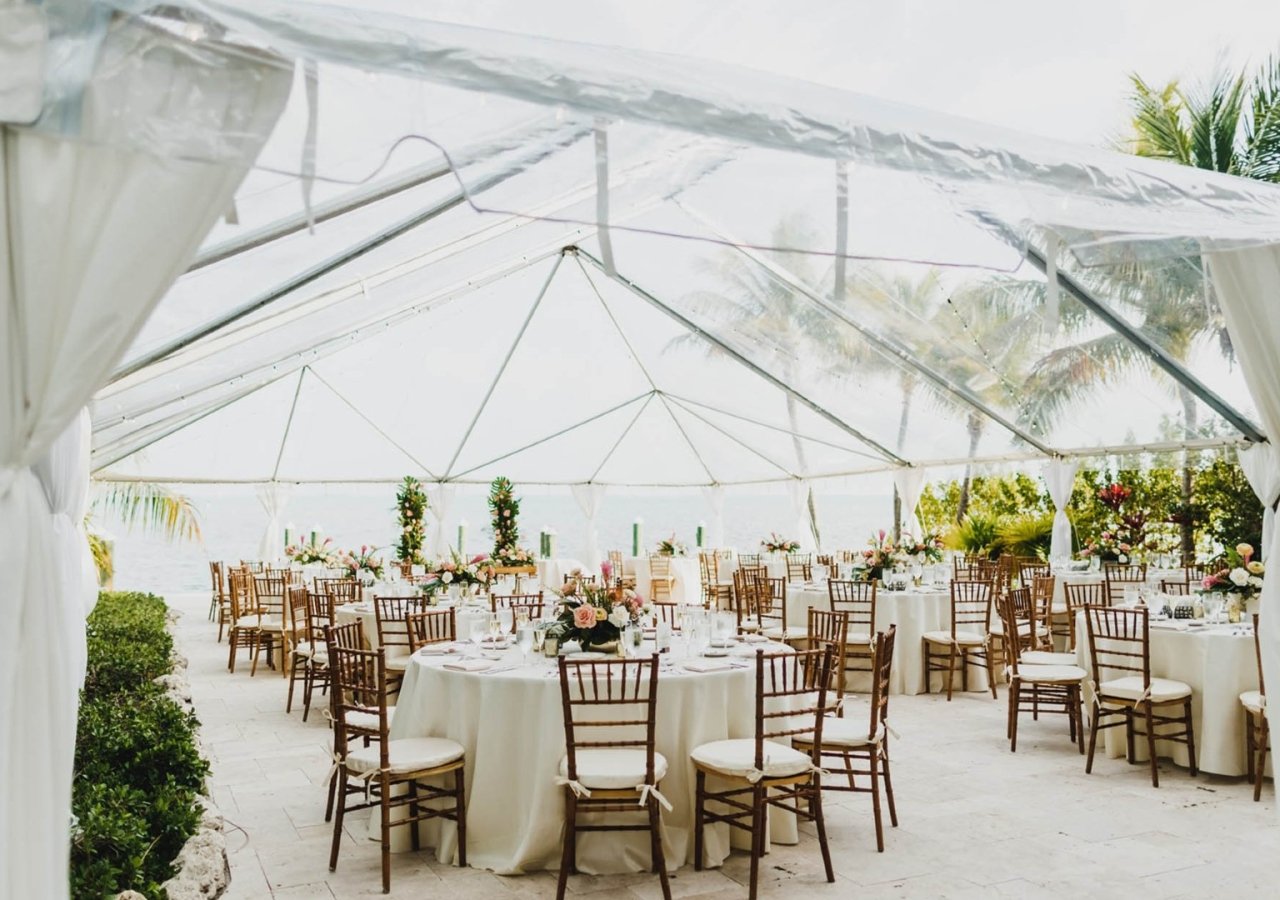 a wedding set up with a tent and tables