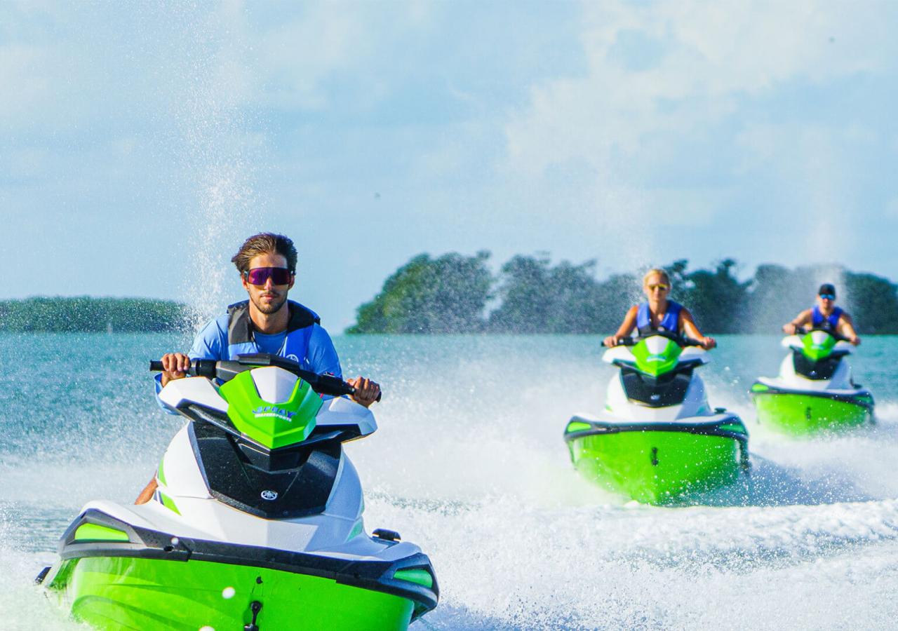 friends riding jetskis