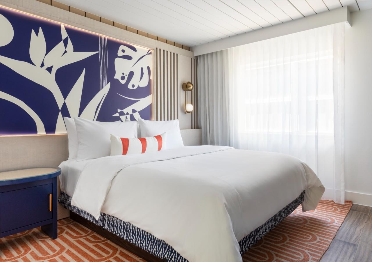 The king bed at The Village, 2 BDR Holiday Isle Suite, 1 King and 2 Queens​ at Three Waters Resort & Marina in Islamorada, Florida.