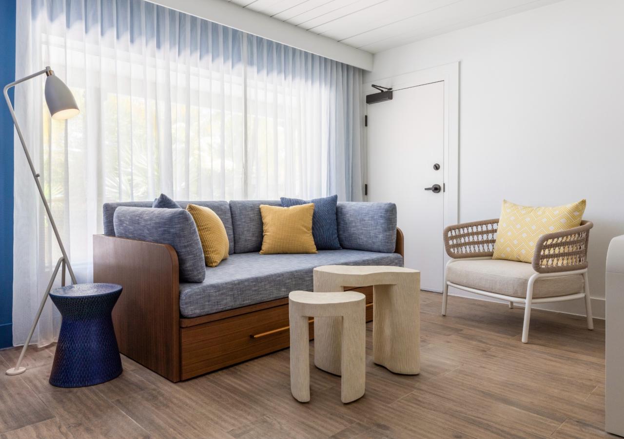 The living room area at The Village, 2 BDR Holiday Isle Suite, 1 King and 2 Queens​ at Three Waters Resort & Marina in Islamorada, Florida.