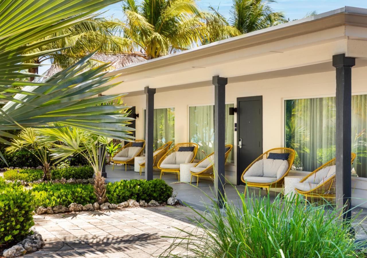 The porch at The Village, 2 BDR Holiday Isle Suite, 1 King and 2 Queens​ at Three Waters Resort & Marina in Islamorada, Florida.