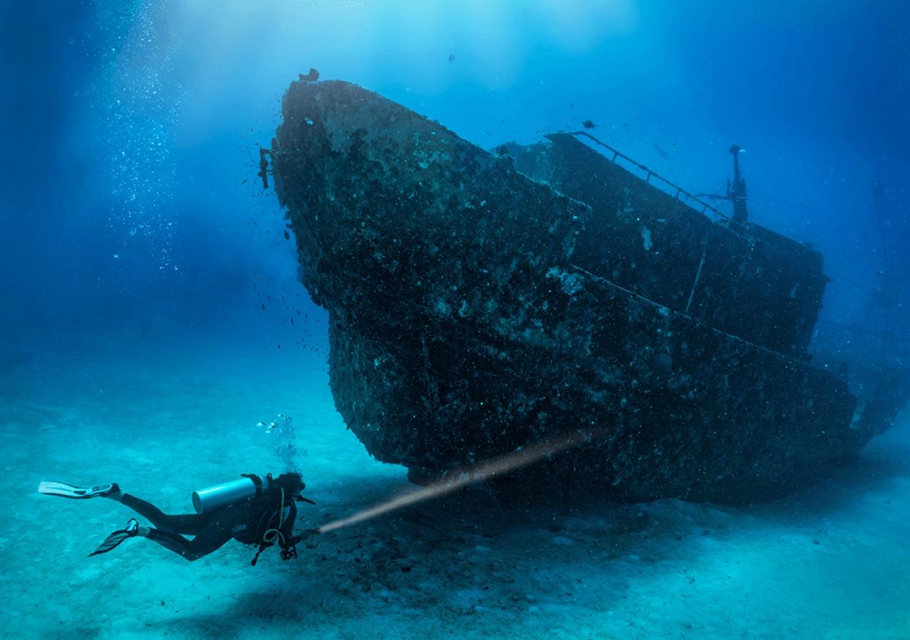 Scuba diver checking out a wreck