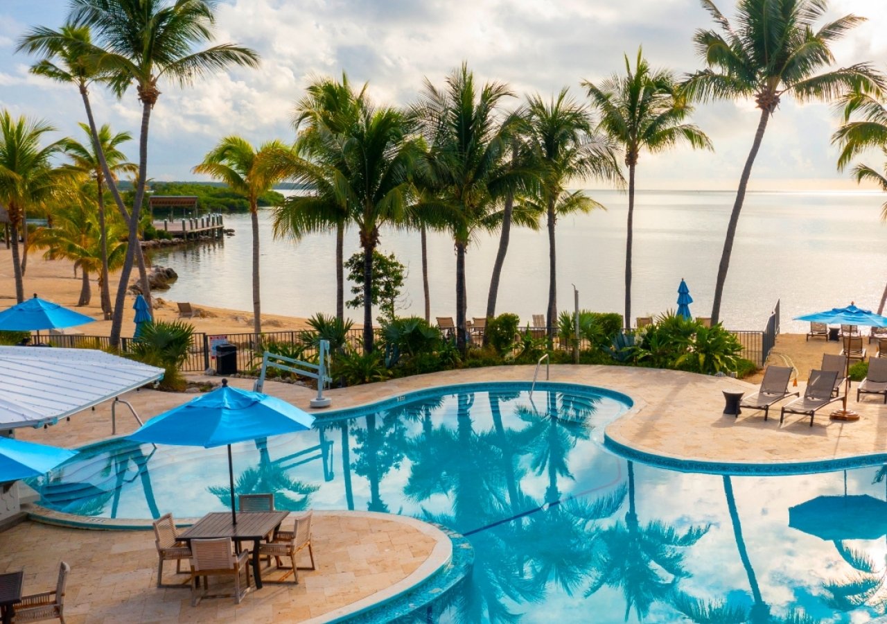 aerial of pool area with view of ocean