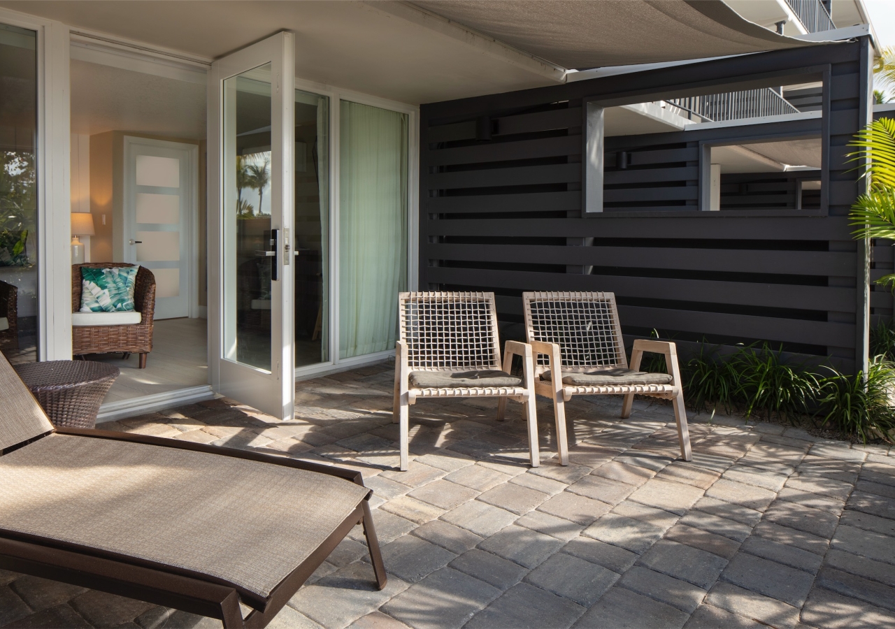 balcony with lounge chairs and wood divider