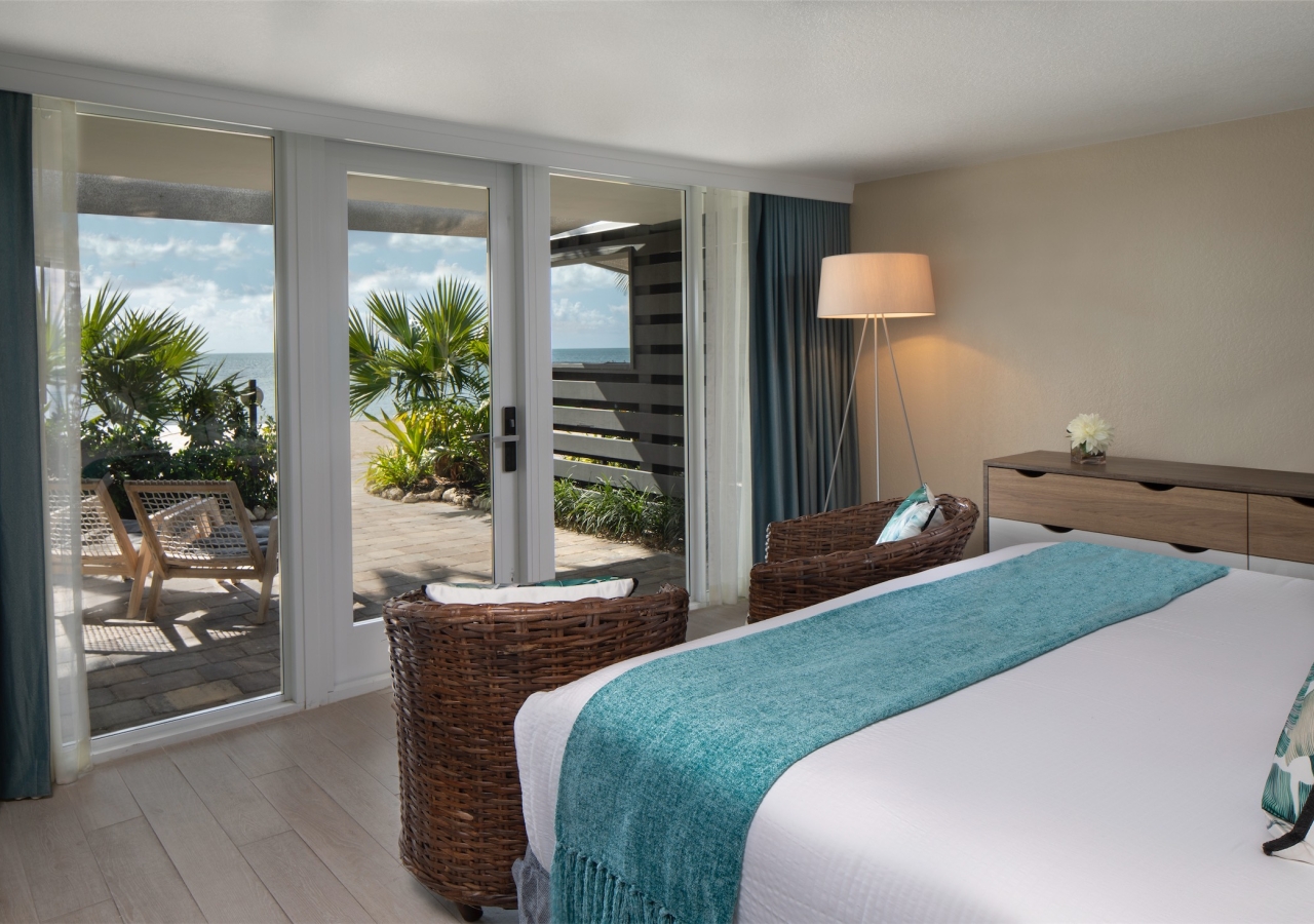 bedroom with balcony looking out towards the beach