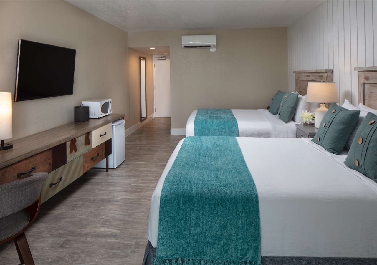 bedroom with two queen beds and microwave and mini fridge