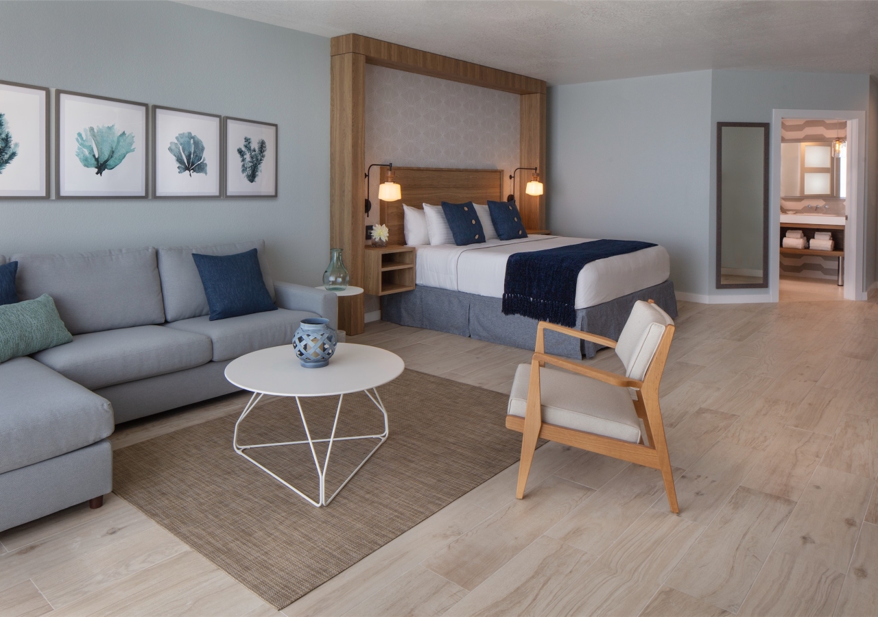 bedroom with small sectional and build in headboard