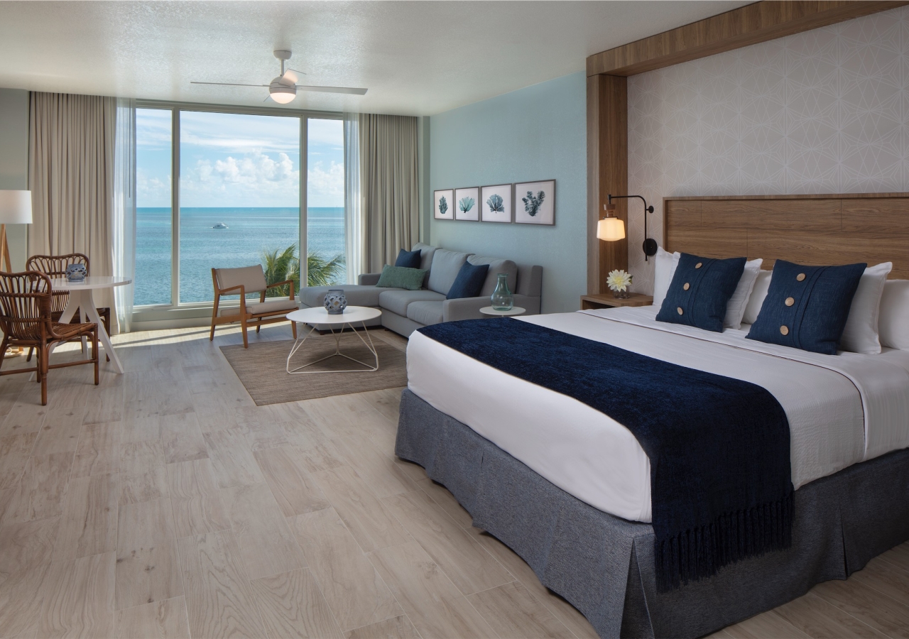 bedroom with small sectional and build in headboard