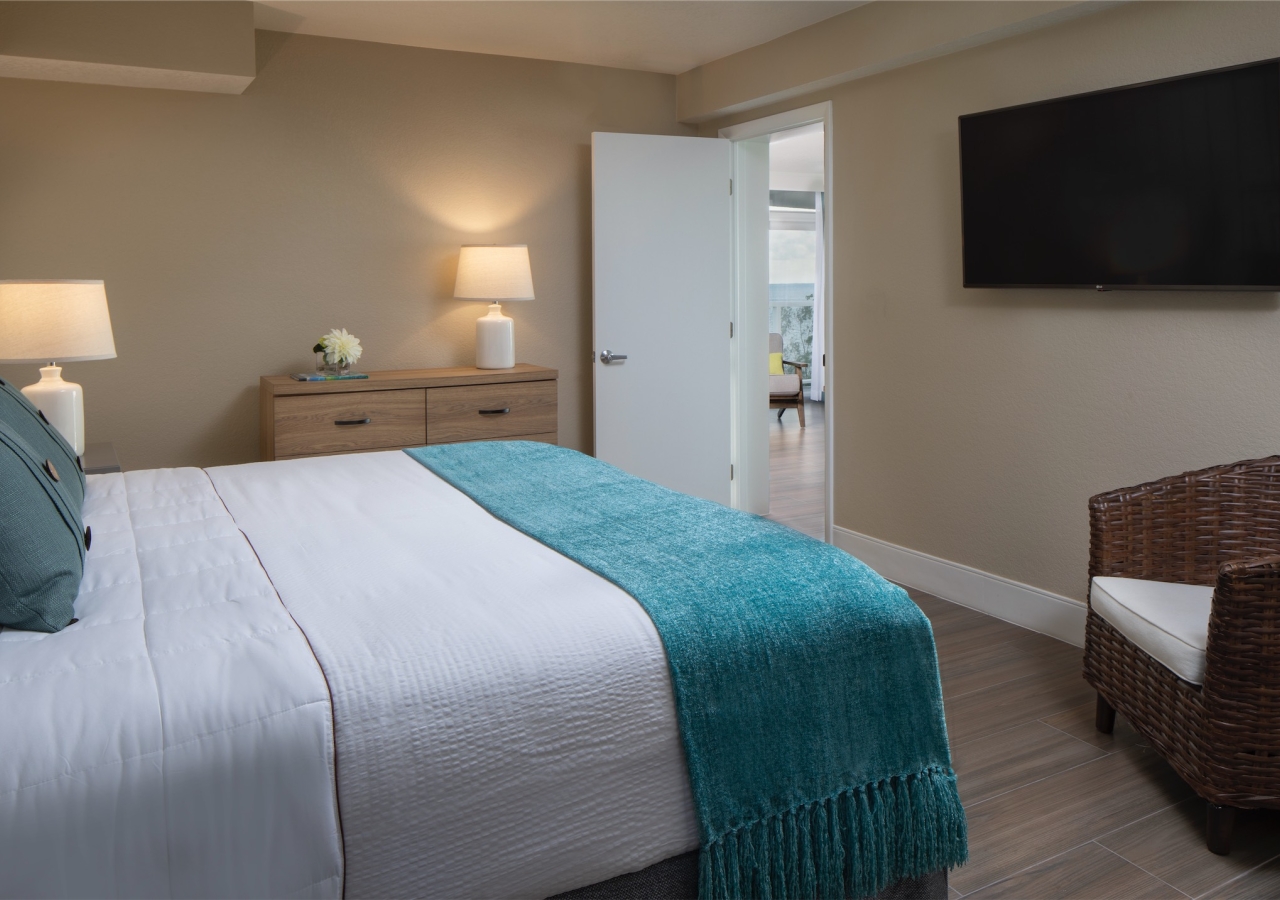 bedroom with nightside table and small sitting area