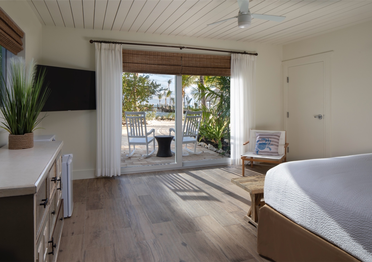 bedroom with balcony overlooking the beach
