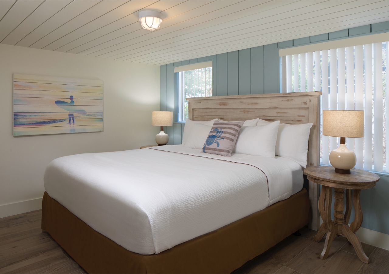 bedroom with blue wood panelled accent wall