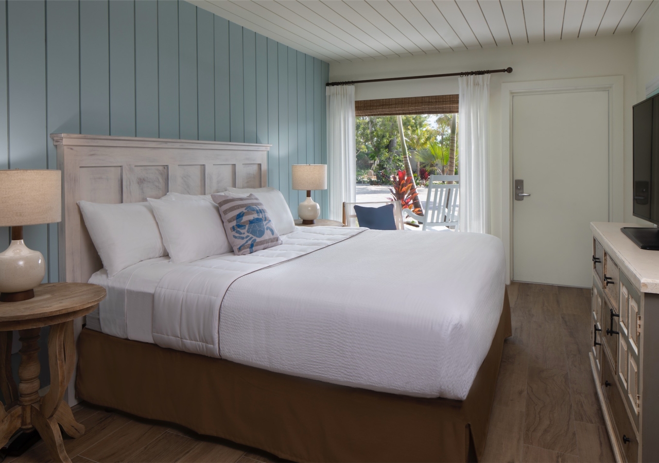 bedroom with blue wood panelled accent wall