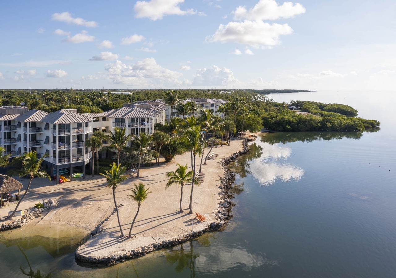 The beach at Pelican Cove with the resort building in the background