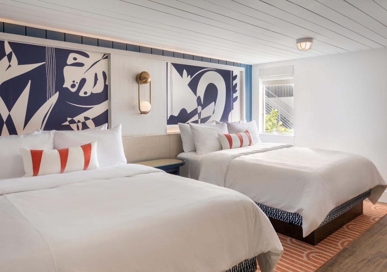 Two queen bed view at The Village, 2 BDR Holiday Isle Suite, 1 King and 2 Queens​ at Three Waters Resort & Marina in Islamorada, Florida.