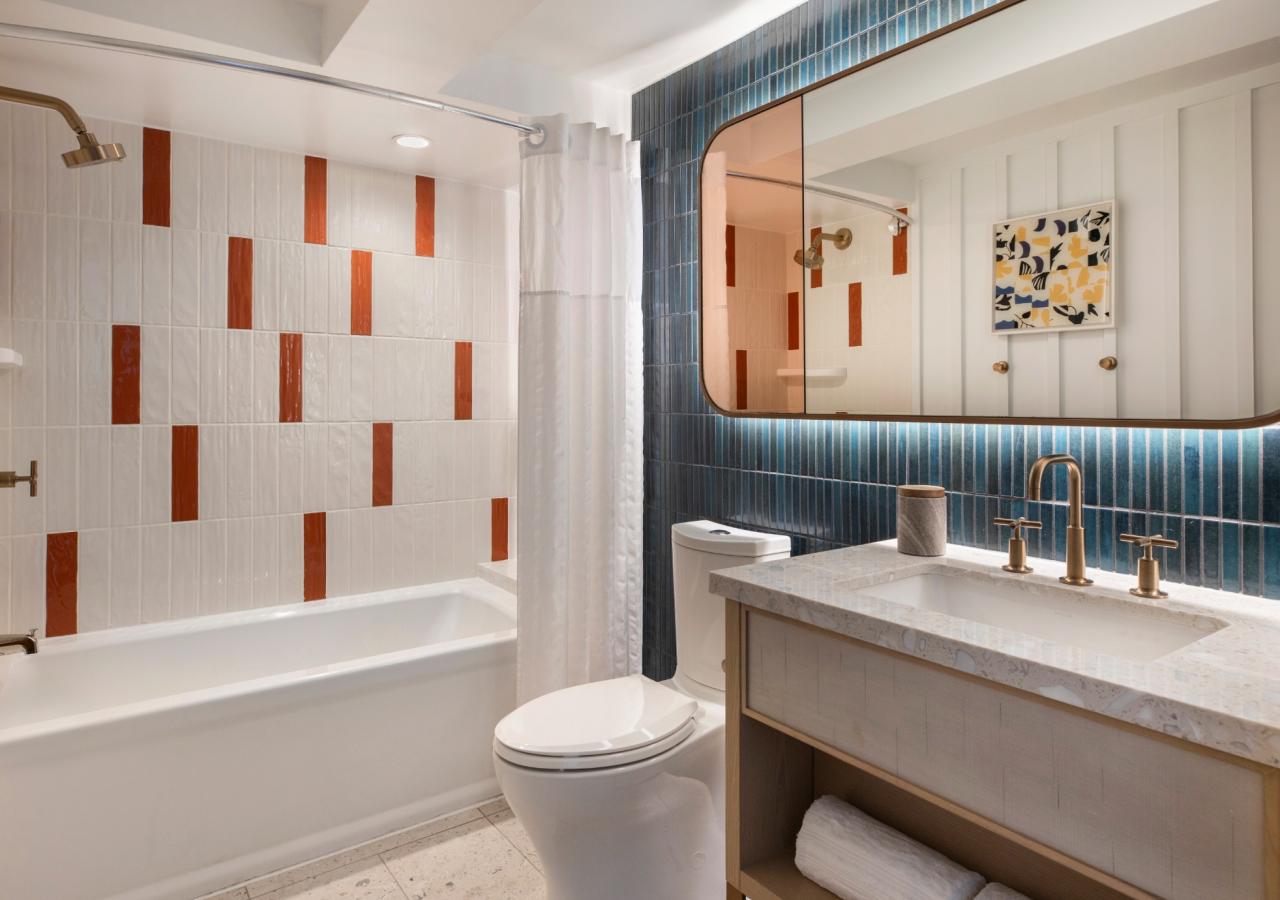The bathroom at The Village, 2 BDR Holiday Isle Suite, 1 King and 2 Queens​ at Three Waters Resort & Marina in Islamorada, Florida.