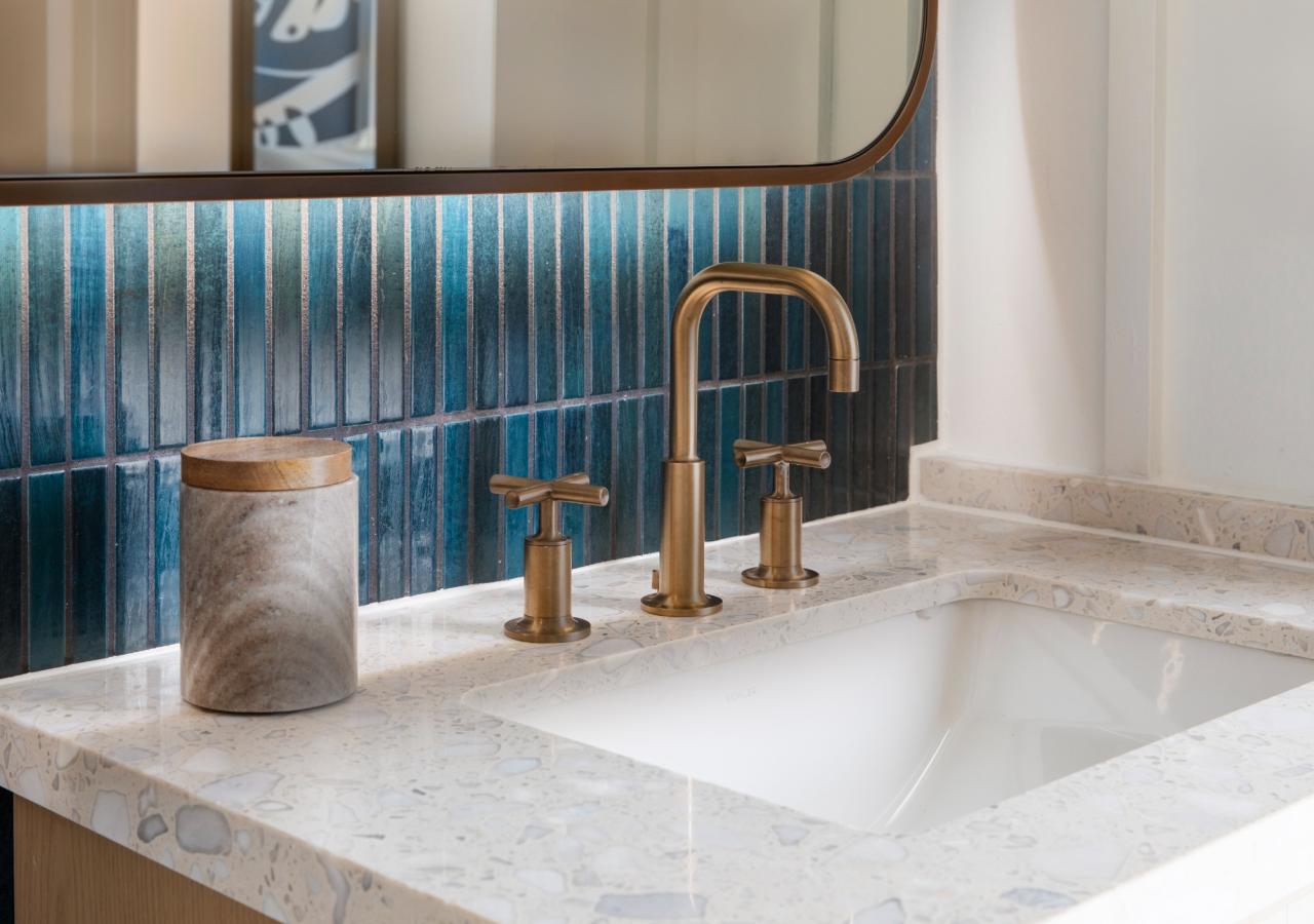 The bathroom sink at The Village, 2 BDR Holiday Isle Suite, 1 King and 2 Queens​ at Three Waters Resort & Marina in Islamorada, Florida.
