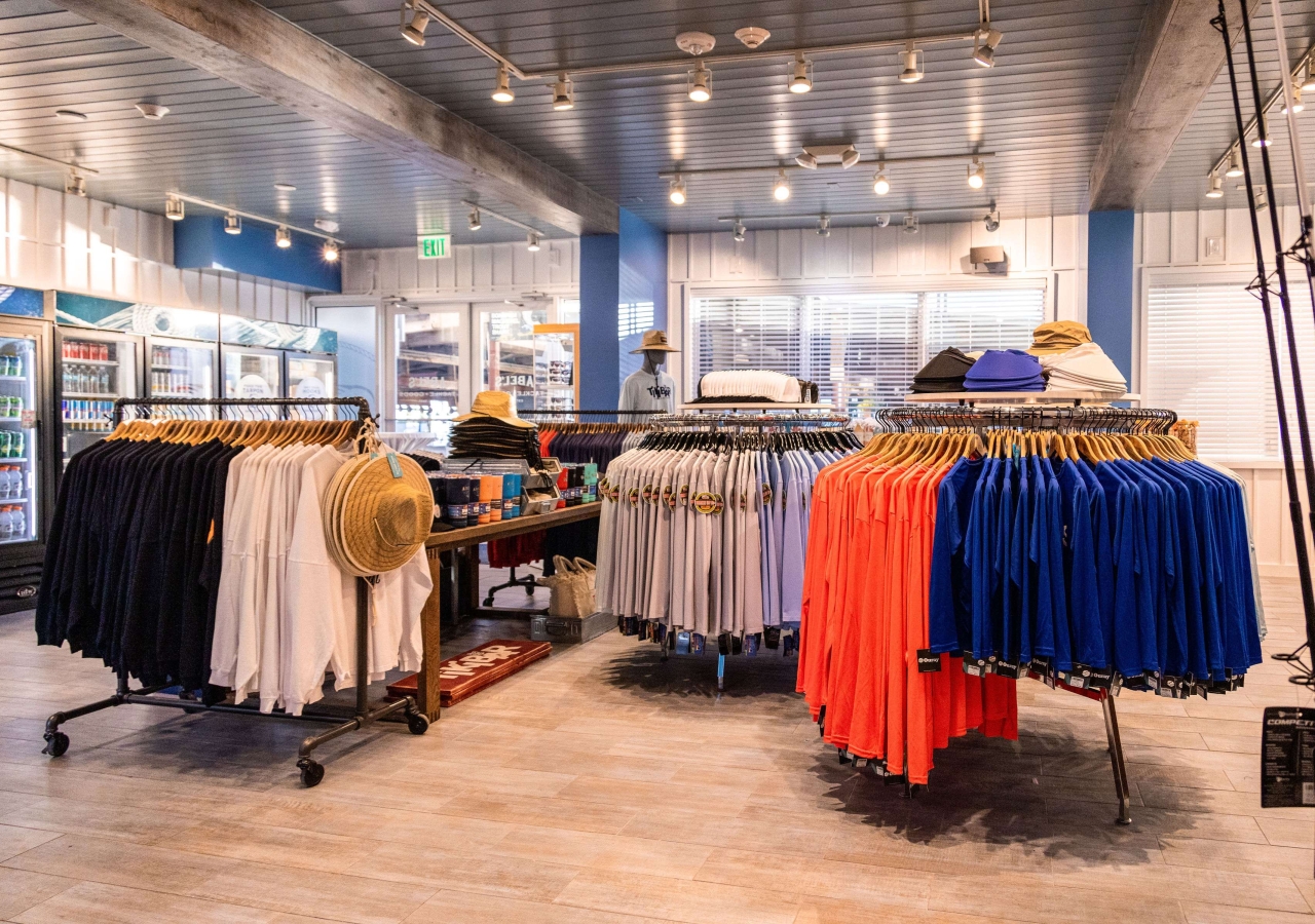 Interior of Abel's Tacklebox with racks of clothing for sale