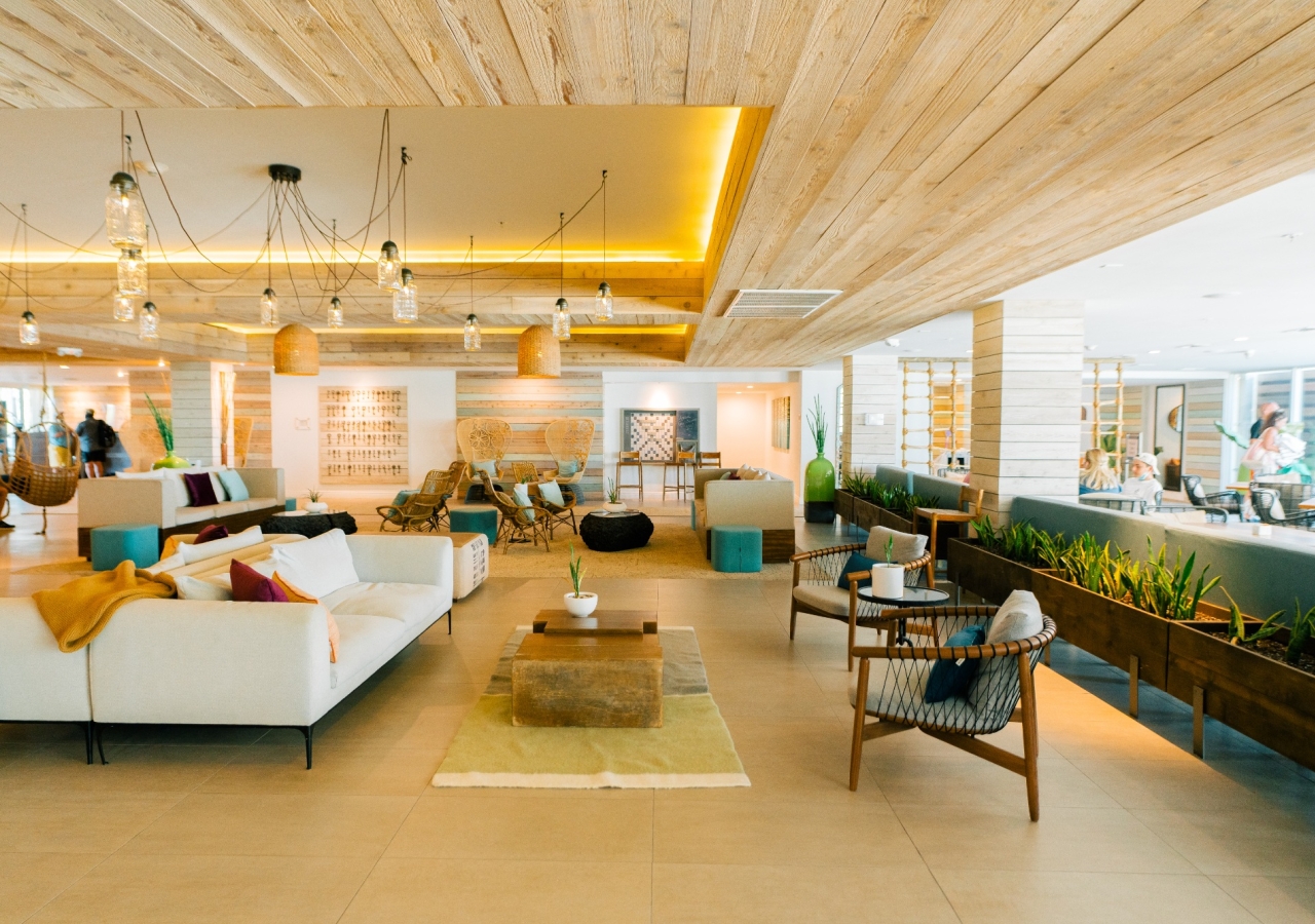 The lobby at Amara Cay, with couches and large windows